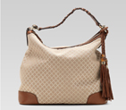 eva hobo with woven leather, tassels, and bamboo detail