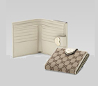 flap french wallet with engraved gucci script logo heart detail